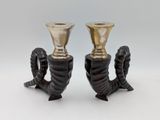 pair of black and gold candlesticks with twisted handles