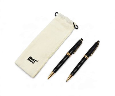two pens and a pouch on a white surface
