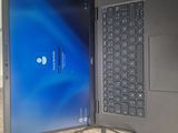 two laptops that are open on a table