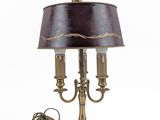 brass plated table lamp with a black shade and a cord