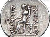 a silver coin with an image of a woman on it