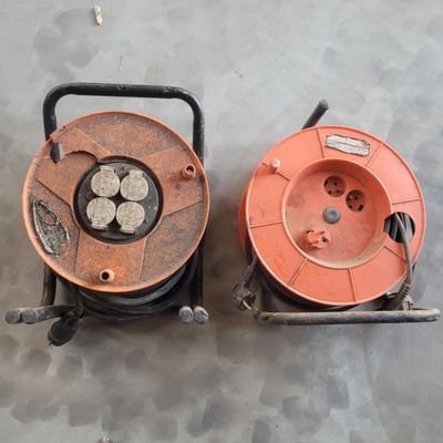 two reels that are sitting next to each other on the floor
