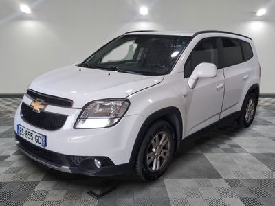 the white chevrolet rav is parked in a room with a checkered floor