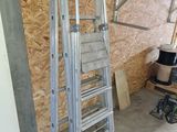 a ladder that is leaning against a wall in a garage