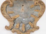 a clock on the wall with roman numerals on it