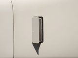 a close up of a door handle on a white truck