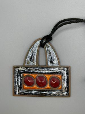 a picture of a picture of an ornament hanging on a wall