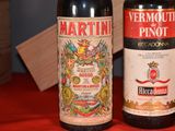 three bottles of wine sitting on a table next to each other