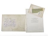 an old envelope with a handwritten letter on it next to a piece of paper