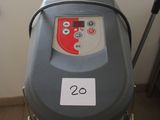 a machine that is sitting on a stand in a room