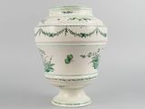 an image of a green and white vase on a gray background