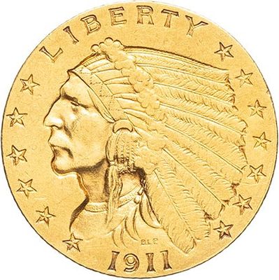 a close up of a gold coin with an indian head on it