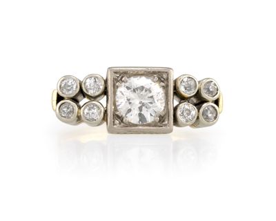 an antique diamond ring with three rows of diamonds in the center