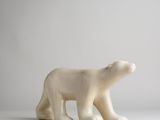 cream colored polar bear figurine on a white surface