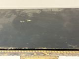 a black table with gold trim and a black top