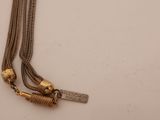 an image of a close up of a necklace on a table