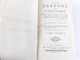 an old book opened to show the title of the book