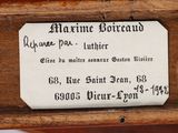 a close up of a label on a piece of wood