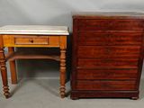 two pieces of furniture including a table and a chest of drawers