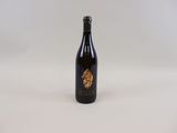 a bottle of wine sitting on top of a white table