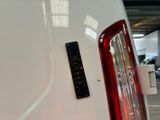 a remote control on the back of a white car