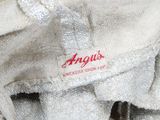 a close up of a stuffed animal with a tag on it ' s back