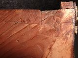 a close up of a piece of wood with a piece of wood sticking out of it