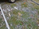 a white trailer that is parked next to a blue car