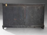 an old black wooden cabinet with two doors and two drawers