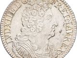 a silver coin with an image of a woman in profile