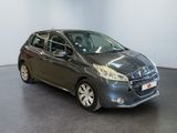 the grey car is parked in a large room with a black floor