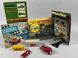 a lot of toy cars and books on the table