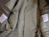 a close up of a jacket with a tag on it