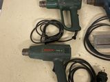three electric tools that are sitting on a table