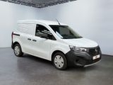 the white van is parked in a large room with white walls