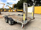 an image of a trailer with a crane in the background