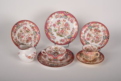 four different types of china plates and cups on a white surface