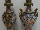 two vases that are sitting next to each other on a table