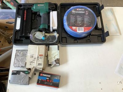 a box of tools on a table with a box of wires