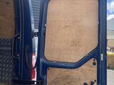 the back of a van with the door open and a bunch of boxes in the back