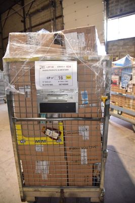 a cart with boxes on top of it in a warehouse