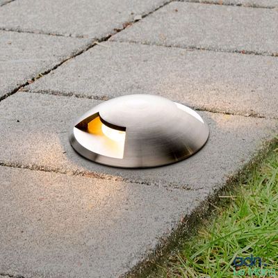 a light that is sitting on the ground in the grass
