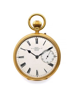 an old gold pocket watch with roman numerals and roman numerals