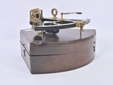 a small wooden box that has a microscope on top of it