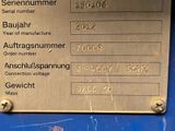 a sign on the side of a blue dumpster
