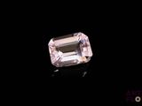 a pink diamond on a black background