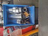 a blue box with tools in it on the floor