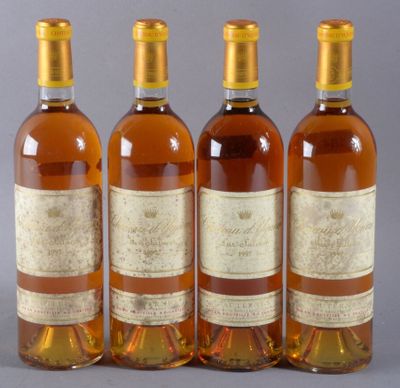 three bottles of wine sitting next to each other on top of a table