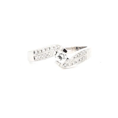 a close up of a diamond ring on a white background
