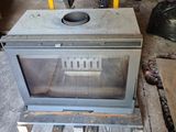 a stove that is sitting in the middle of a room